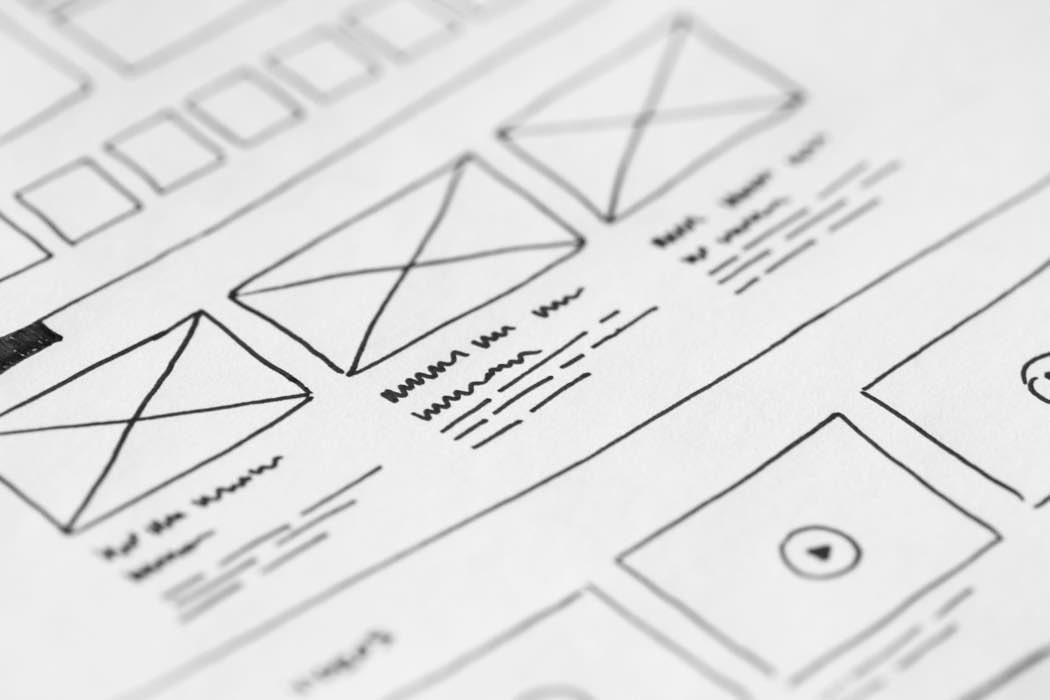A hand-drawn wireframe sketch mapping out a website's page layout